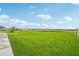 Expansive green space offers plenty of room for outdoor activities and enjoying the community's natural surroundings at 1211 Normandy Dr, Haines City, FL 33844