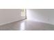Bright bedroom with a window provides a peaceful retreat within the home at 13 Oak Trail Pl, Ocala, FL 34472
