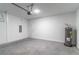 Attached garage with automatic door, water heater, and electrical panel at 13 Oak Trail Pl, Ocala, FL 34472