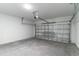Attached garage with an automatic door and concrete floors at 13 Oak Trail Pl, Ocala, FL 34472