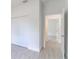 Hallway leading to bedrooms with closets offers storage options and accessibility at 13 Oak Trail Pl, Ocala, FL 34472
