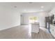 Modern kitchen with an island, stainless steel appliances, and an open view to the living area at 13 Oak Trail Pl, Ocala, FL 34472
