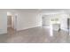 Bright and airy living area showcasing tile floors and an open layout to the kitchen at 13 Oak Trail Pl, Ocala, FL 34472