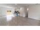 Open-concept living space featuring tile flooring and a modern kitchen with an island at 13 Oak Trail Pl, Ocala, FL 34472