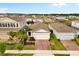 Charming single-story home with a brick driveway and well-manicured landscaping at 1580 Eucalyptus Way, Davenport, FL 33837