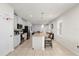 A modern kitchen with stainless steel appliances, a granite island and white cabinets at 1580 Eucalyptus Way, Davenport, FL 33837