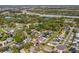 Spacious suburban homes nestled among mature trees and landscaping, with a highway in the distance at 1624 Malcolm Pointe Dr, Winter Garden, FL 34787