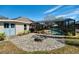 Enjoy outdoor living with a fire pit area and screened-in pool at 1624 Malcolm Pointe Dr, Winter Garden, FL 34787