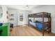 Bright bedroom with wood floors and bunk beds provides a comfortable and playful living space at 1624 Malcolm Pointe Dr, Winter Garden, FL 34787