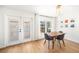 Dining area leading to the outdoor pool area through French doors at 1624 Malcolm Pointe Dr, Winter Garden, FL 34787