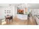 An open-concept kitchen features stainless steel appliances, granite countertops, and a breakfast bar at 1624 Malcolm Pointe Dr, Winter Garden, FL 34787