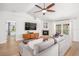 Comfortable living room with fireplace, large TV, and sliding glass doors to the outdoor area at 1624 Malcolm Pointe Dr, Winter Garden, FL 34787