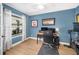 Well-lit home office provides a modern and comfortable work space at 1624 Malcolm Pointe Dr, Winter Garden, FL 34787