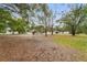 Large backyard with mature trees that provides plenty of shade and privacy at 16336 Old Cheney Hwy, Orlando, FL 32833