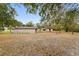 Large backyard with a detached garage and plenty of space for outdoor activities at 16336 Old Cheney Hwy, Orlando, FL 32833