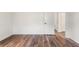 Bright bedroom featuring wood-look flooring, clean walls and an open door at 16336 Old Cheney Hwy, Orlando, FL 32833