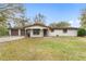 Charming single-story home with a well-maintained lawn and attached two-car garage at 16336 Old Cheney Hwy, Orlando, FL 32833