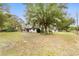 Charming ranch-style home featuring an expansive front yard and mature trees, exuding a serene, country-like atmosphere at 16336 Old Cheney Hwy, Orlando, FL 32833