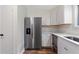 Bright kitchen featuring stainless steel appliances, stone countertops and ample storage space at 16336 Old Cheney Hwy, Orlando, FL 32833