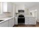 Modern kitchen with stone countertops, stainless appliances, and an open layout perfect for entertaining at 16336 Old Cheney Hwy, Orlando, FL 32833