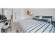Neutral bedroom with a striped bed, workspace, and comfortable layout at 1802 Candlenut Cir, Apopka, FL 32712