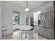 Bright kitchen nook with stainless steel appliances and access to the screened lanai at 1802 Candlenut Cir, Apopka, FL 32712