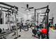Home gym with a ceiling fan, mirror, and variety of exercise equipment at 1802 Candlenut Cir, Apopka, FL 32712