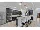 Spacious kitchen featuring stainless steel appliances, granite countertops, and island seating at 1802 Candlenut Cir, Apopka, FL 32712