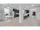 Open kitchen with stainless steel appliances, granite countertops, breakfast table, and dark wood cabinetry at 1802 Candlenut Cir, Apopka, FL 32712