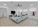 Spacious living area showcasing a large sectional sofa with pool views from the bright and sunny windows at 1802 Candlenut Cir, Apopka, FL 32712