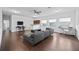 Upstairs living room featuring hardwood floors, a workspace and comfortable sofa at 1802 Candlenut Cir, Apopka, FL 32712
