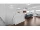 Bright upper living room area featuring wood floors, a sofa and an office space at 1802 Candlenut Cir, Apopka, FL 32712