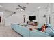 Comfortable living room area showcasing a sectional sofa and entertainment center at 1802 Candlenut Cir, Apopka, FL 32712