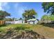Expansive backyard with a clear view of shed conversion and fencing at 1900 E Orange Ave, Eustis, FL 32726