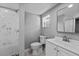 Clean bathroom with white toilet, sink and vanity plus large shower at 1900 E Orange Ave, Eustis, FL 32726