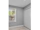 Bedroom featuring natural light, closet and wood floors at 1900 E Orange Ave, Eustis, FL 32726