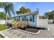 Inviting home exterior with a cozy porch and neatly landscaped front yard at 1900 E Orange Ave, Eustis, FL 32726