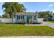 Charming single-story home with well-maintained lawn and mature trees offering curb appeal at 1900 E Orange Ave, Eustis, FL 32726