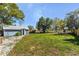 Side view of blue shed conversion, showing the backyard at 1900 E Orange Ave, Eustis, FL 32726