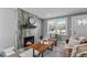 Stylish living room featuring a modern fireplace and a cozy seating area at 1900 E Orange Ave, Eustis, FL 32726