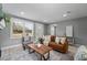 Bright living room with a comfortable seating arrangement and natural light at 1900 E Orange Ave, Eustis, FL 32726