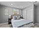 Bedroom features comfortable bed, stylish decor, and ample natural light at 1900 E Orange Ave, Eustis, FL 32726