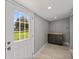 Mud room with outdoor access features a small cabinet at 1900 E Orange Ave, Eustis, FL 32726