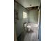 Bathroom awaiting renovation featuring a new toilet, tub, window, and open ceiling with exposed fixtures at 1905 S Westmoreland Dr, Orlando, FL 32805