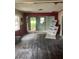 This living room is under construction with exposed framing and unfinished floors; awaiting your personal touch at 1905 S Westmoreland Dr, Orlando, FL 32805