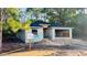 New construction home with block walls, a new roof, and a two-car garage at 2132 Pine Meadows Golf Course Rd, Eustis, FL 32726