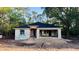 New construction home with block walls, a new roof, and a two-car garage at 2132 Pine Meadows Golf Course Rd, Eustis, FL 32726