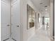 Bright hallway featuring tile floors, recessed lighting, and contemporary wall decor at 2334 Lily Bloom Rd, St Cloud, FL 34771
