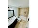 Bathroom featuring a vanity sink, toilet, and tiled shower-tub combo with recessed shelving at 238 Riverbend Dr # 105, Altamonte Springs, FL 32714