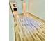 Bright bedroom with wood-look flooring and access to a bathroom at 238 Riverbend Dr # 105, Altamonte Springs, FL 32714